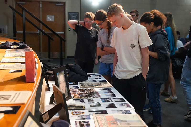 students examining table with 9/11 primary sources