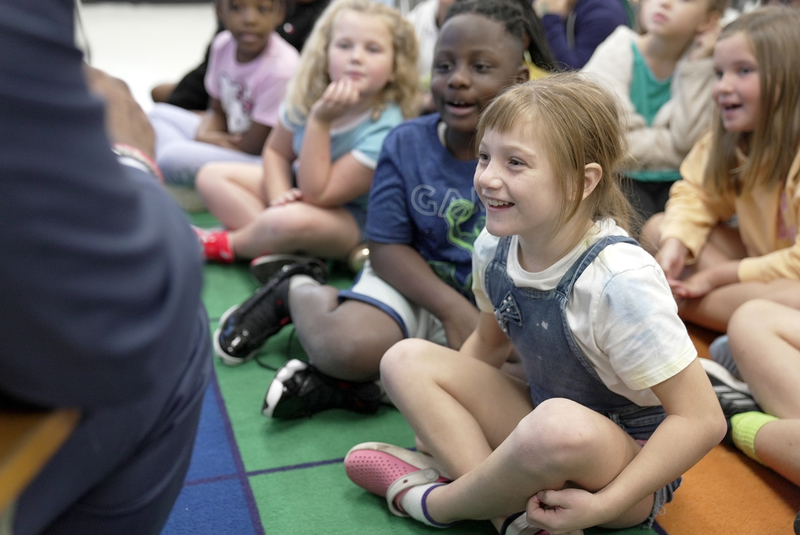 children laughing at book