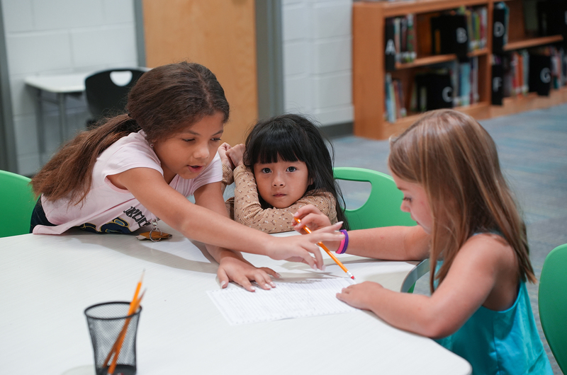 three girls working together