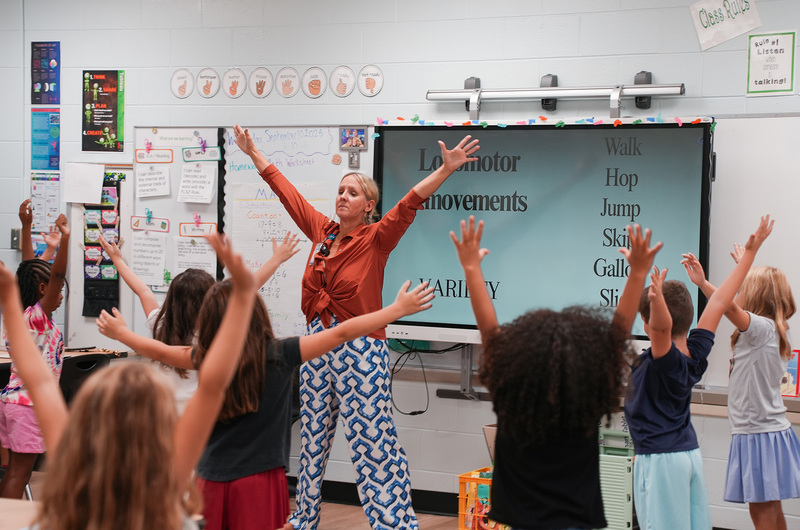 kim steel doing dance lesson with students