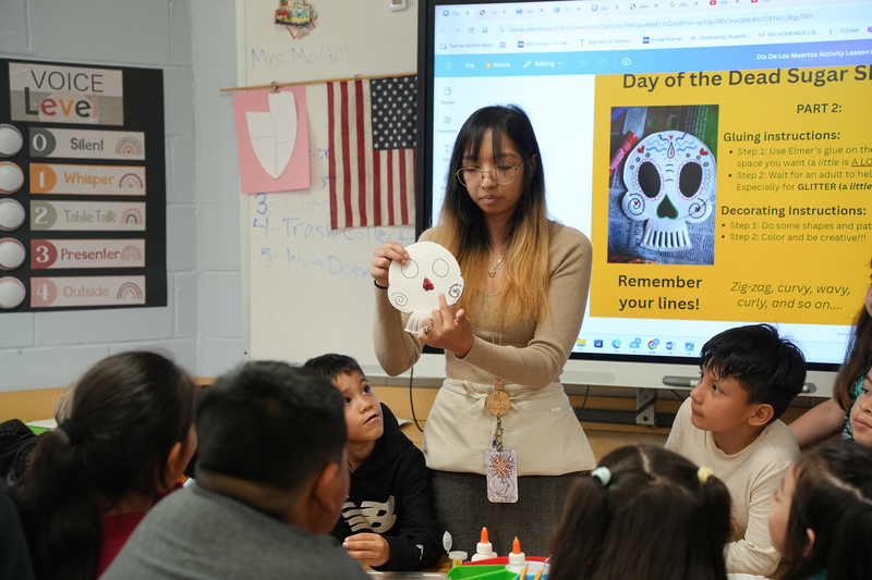 maria mcgill showing students artwork
