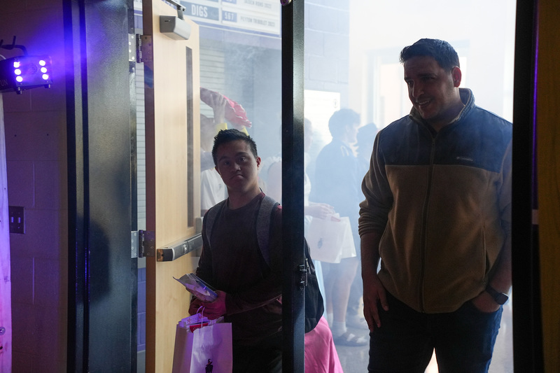 staff and student entering gym