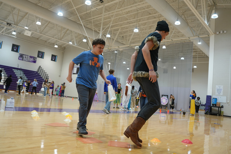 two students doing obstacle course
