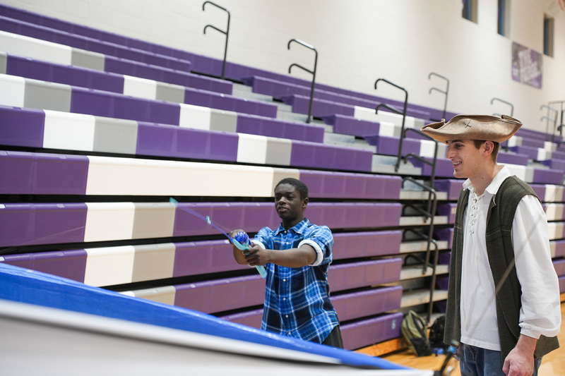 two students playing fishing