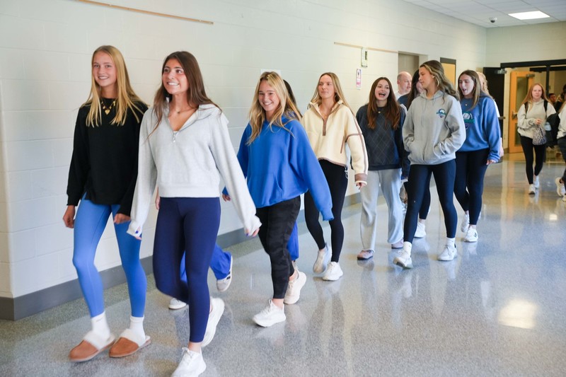 team marching in hallway