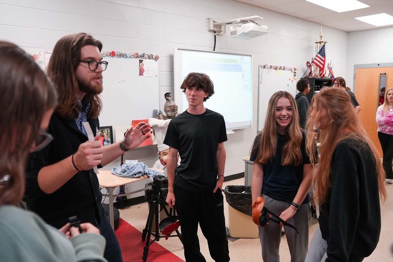teacher working with students