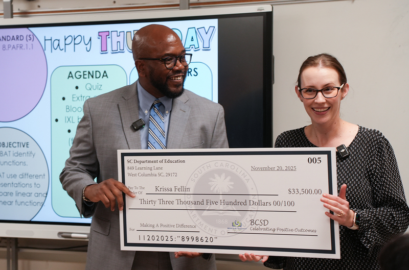 teacher and dixon with check