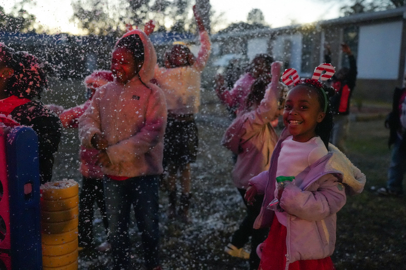 students playing in fake snow