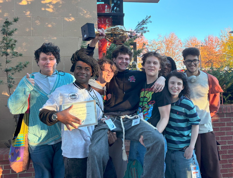 students with trophy