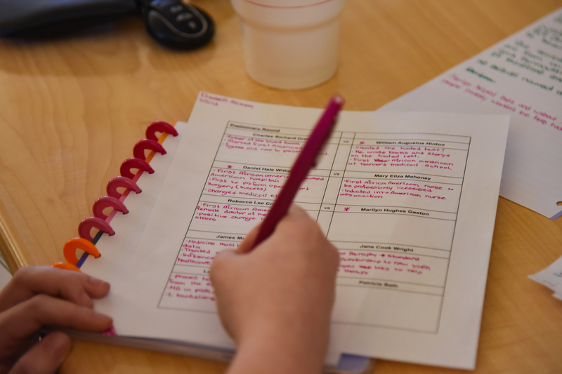 student taking notes