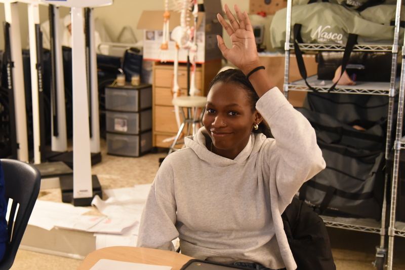 student raising hand