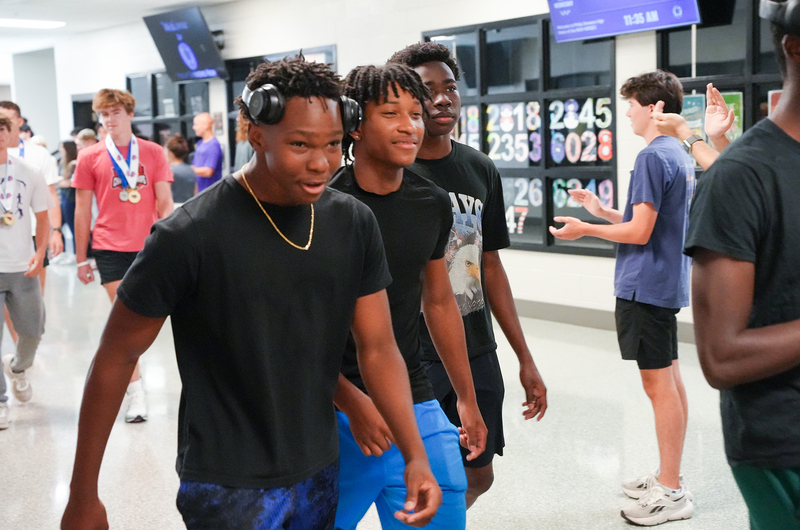 boys walking in hallway