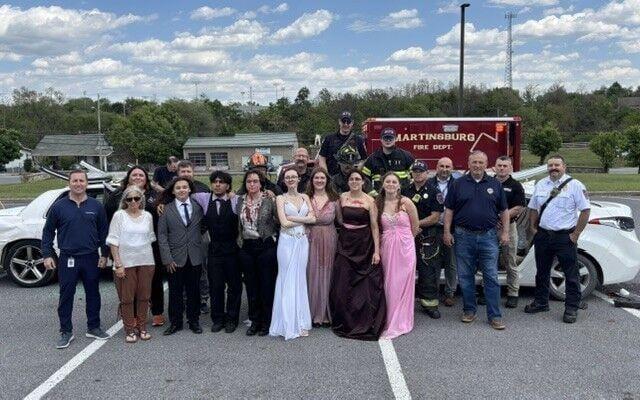 students in front of ambulance
