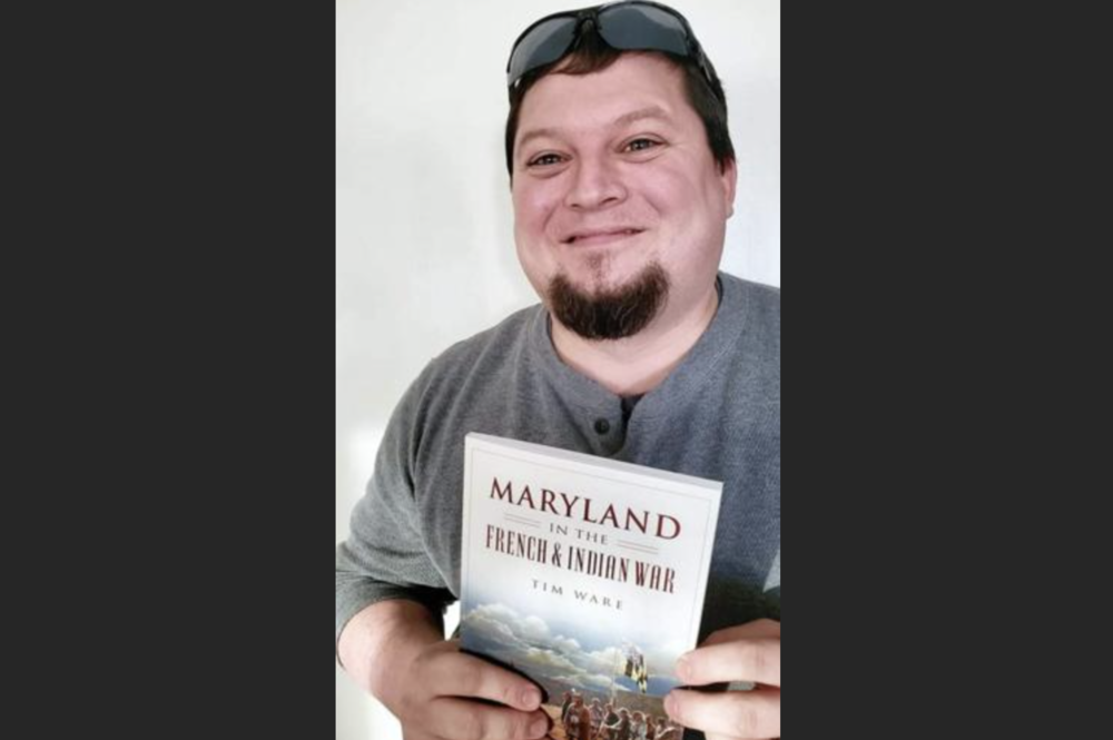 image of timothy ware holding a book