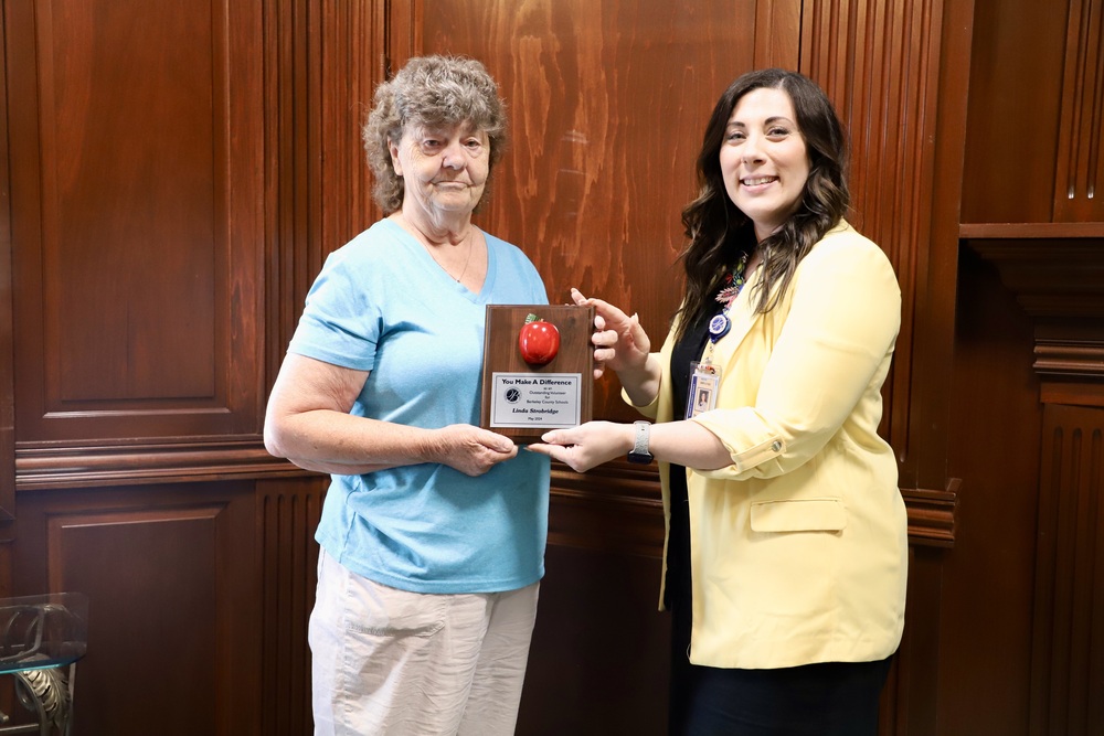 May Volunteer of the Month Linda Strobridge standing with Tomahawk Intermediate School Principal Krista  Ematrudo