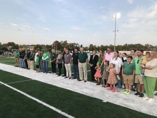 families standing on field