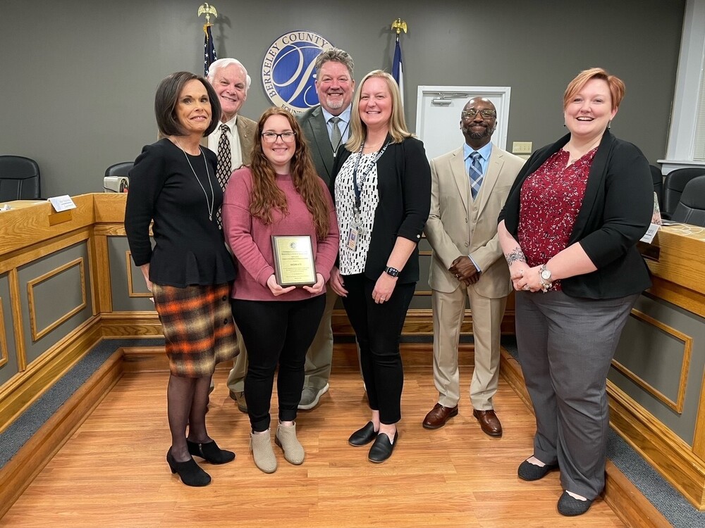 image of secretary ragan hite with board members and principal