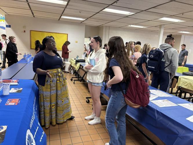 students talking to career professionals
