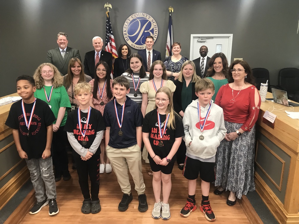 Students from Musselman Middle and Mountain Ridge Middle Battle of the Books winners with their school librarians and members of the board