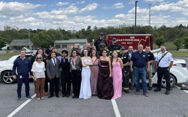 students in front of ambulance
