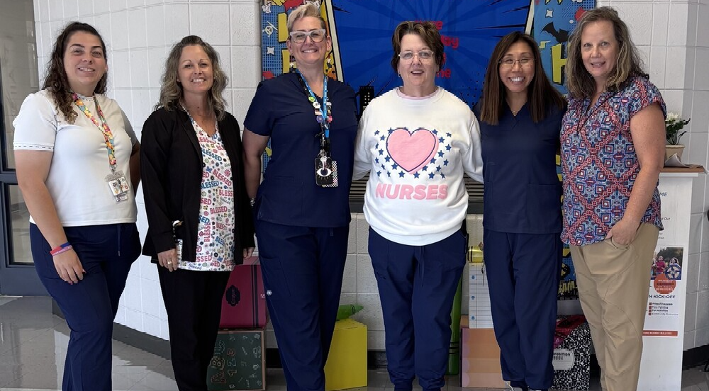 The school counselors all dressed like nurses with our Nurse, Ms. Failes.