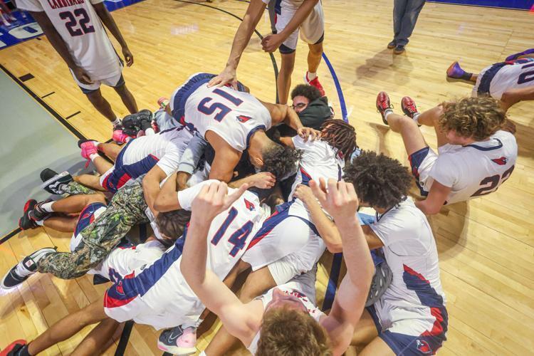 basketball players start a dogpile in celebration