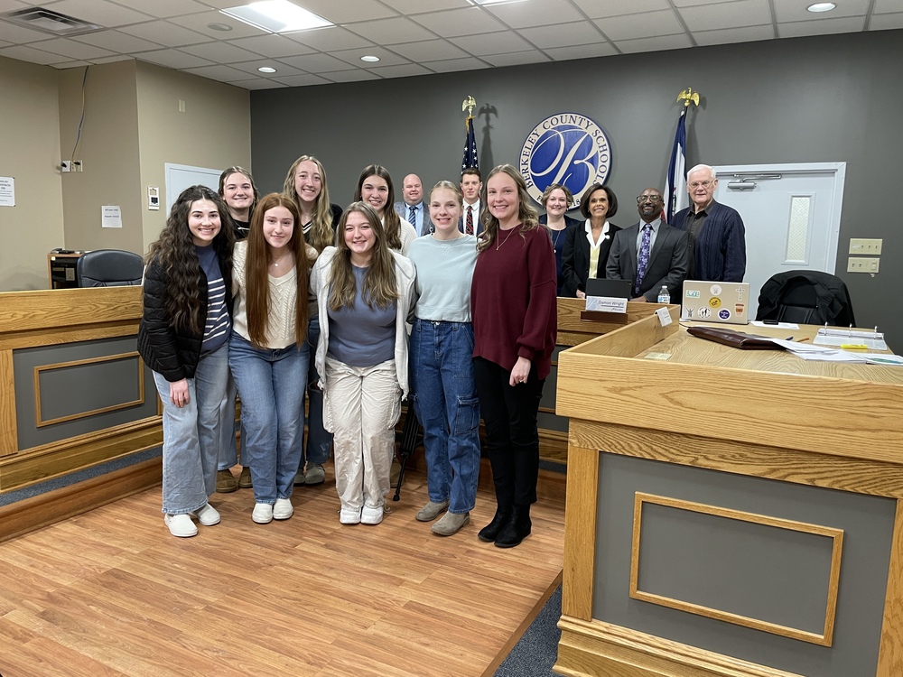 Hedgesville Volleyball team with Dr. Saxe, and members of the board