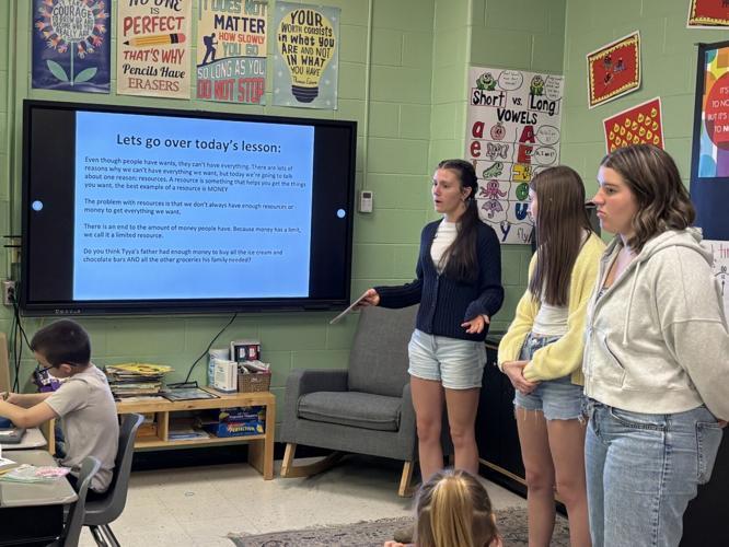 Finance Students reading to Elementary students