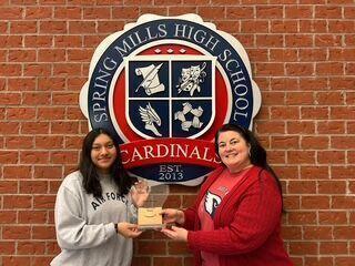 image of rebecha catlett presenting award to jasmin gutierrez