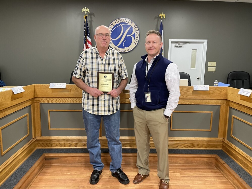 image of eddie mcdonald standing with patrick ashton