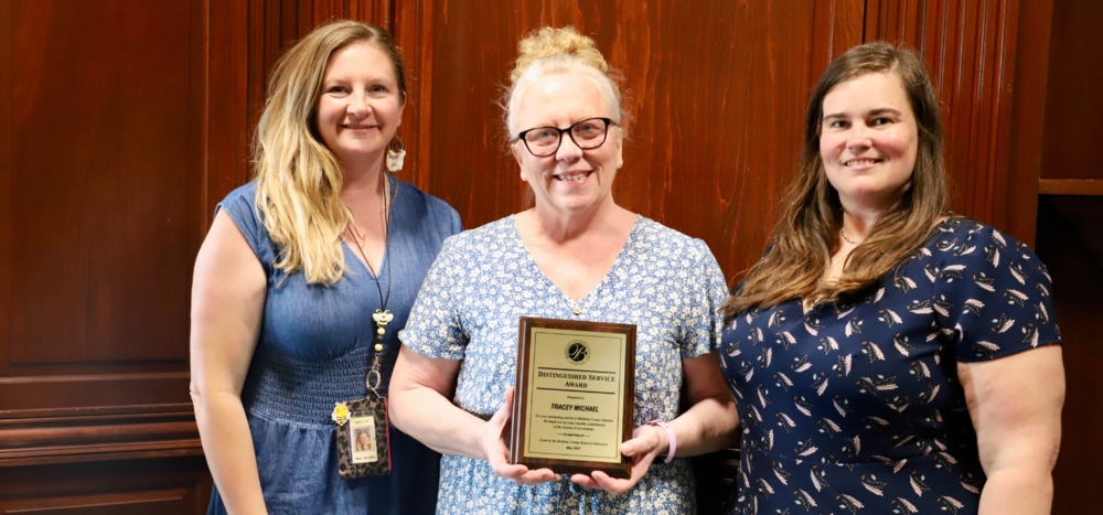 image of May2024 distinguished service award recipient Tracey Michael standing with principal Nicole Krause and Teacher Alica Shaffer
