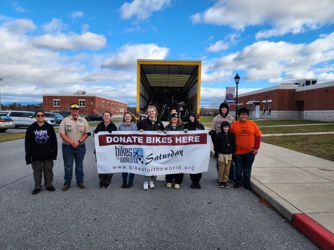 Among those who helped Spring Mills High School senior Olivia Morrison, fifth from left, collect used bikes and gear on Nov. 23 at the school to benefit Bikes for the World are, from left, McKayla Salazar, Jayden Travis, Julia Stedman, Amaya Cole, Cassidy Bayer, Sophia Prieto, Zach Uccellini (in beanie), Thomas Henson (in front of Zach) and Dominic Lopez (in orange). Submitted photo