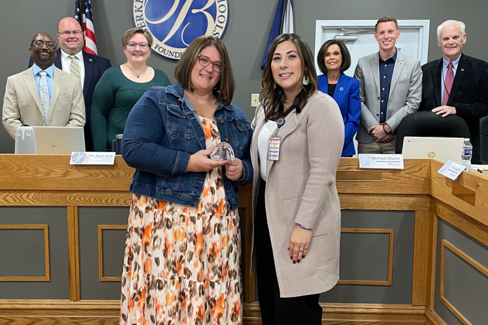 Jessica Care with principal Krista Emtrado, Superintendent Saxe, and members of the Board