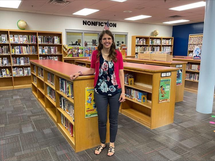 Orchard View Intermediate School staff Cassandra Berry poses in the school's library. Orchard View was recently named a recipient of the Laura Bush Foundation for America's Libraries Grant.