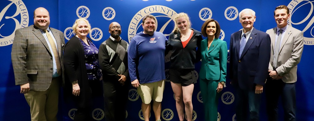 Kaylie hall with members of the board