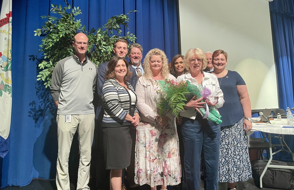 image of luke seno receiving ACE award from superintendent and board members