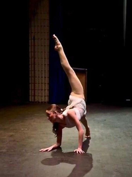 A solo dancer contorts on stage at Hedgesville High School on Sunday