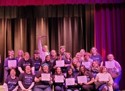 Students and Hedgesville High School pose with over nearly a dozen different awards.
