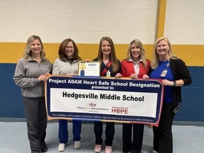 Ashley Watson and Tracy Coup from WVU Medicine, Penny Creel, Judy McCune and Principal Elizabeth Adams.