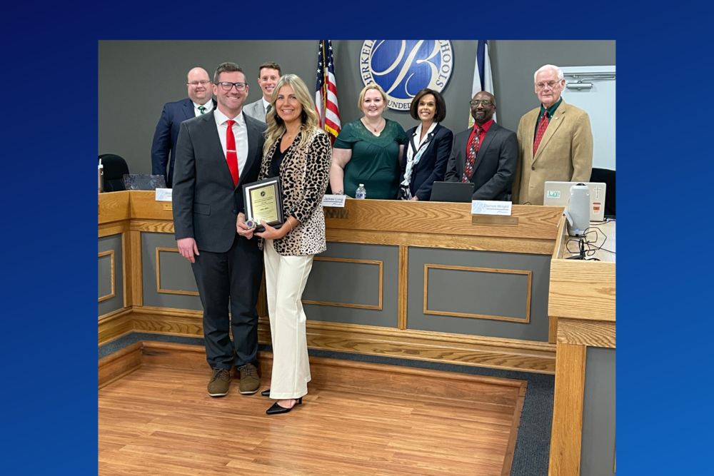 Erica Smith with Craig Arch, Dr. Saxe, and members of the board