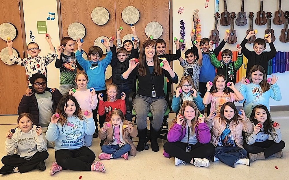students and teacher with Latin Percussion egg shakers