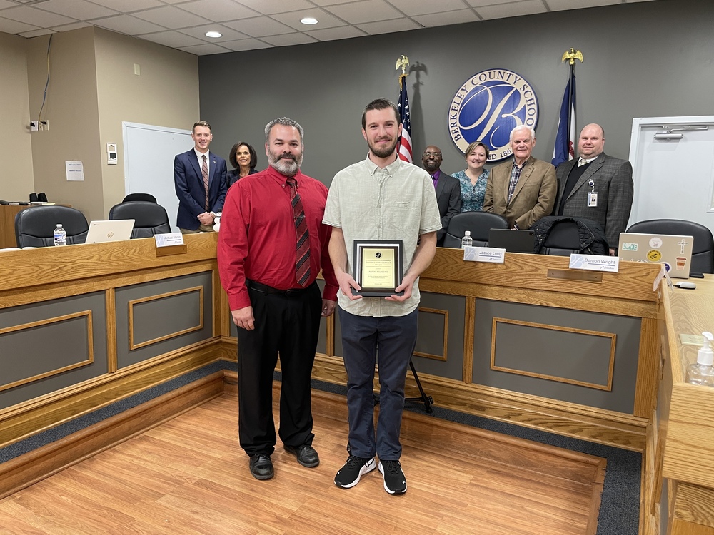 Brandon Burkhart, Robert Belissimo, board members, and superintendent