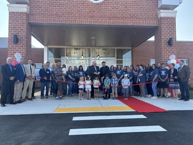 Superintendent Ryan Saxe and Principal Ryan Ott cut the ribbon for the Hedgesville Early Learning Academy on Friday.