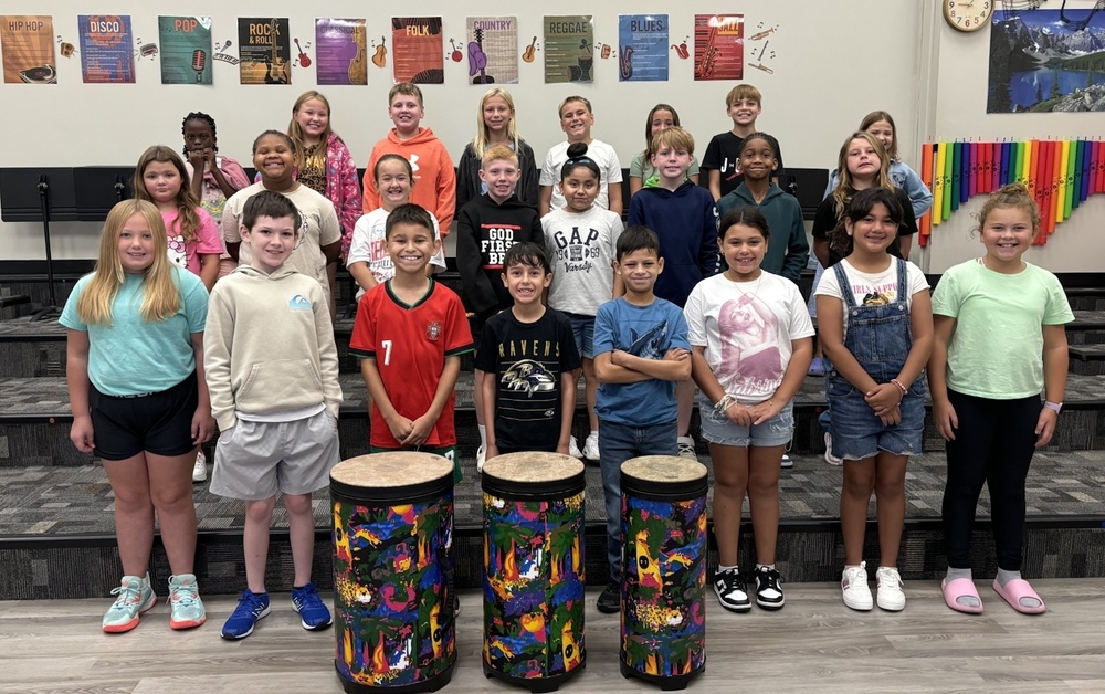 Students from Tomahawk Intermediate with the Drums Donated by Friends of Music