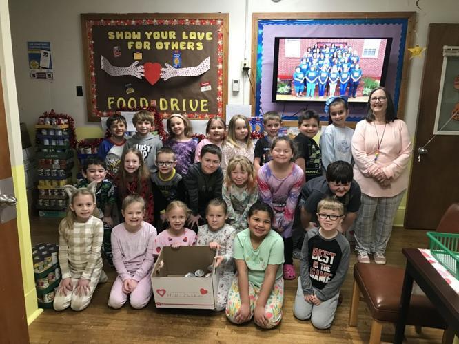 Anna Hill-Dobbins’ first-grade class is pictured during Pajama Day on Tuesday. It won first place for collecting the most food
