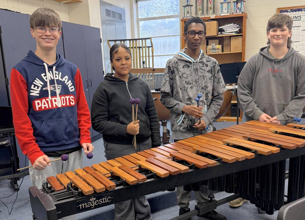students standing behind the new marimba