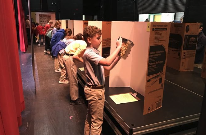 image of students participating in physical estimation activity at math field day