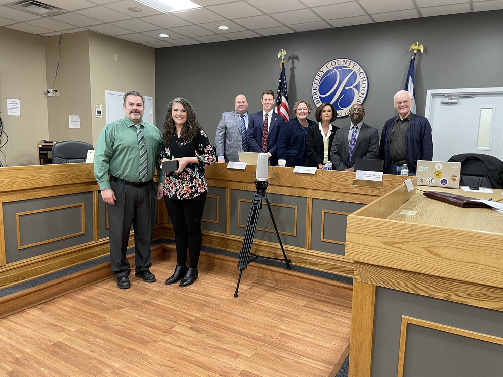 Brianna Niewodowski, Brandon Burkhart, Dr. Saxe, and members of the board