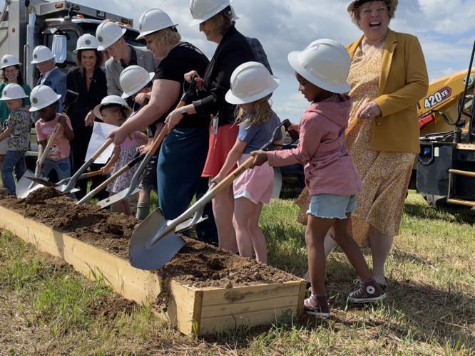 Gerrardstown Elementary and Inwood Primary students turn over dirt at the Mountain Ridge Primary School groundbreaking on Wednesday.