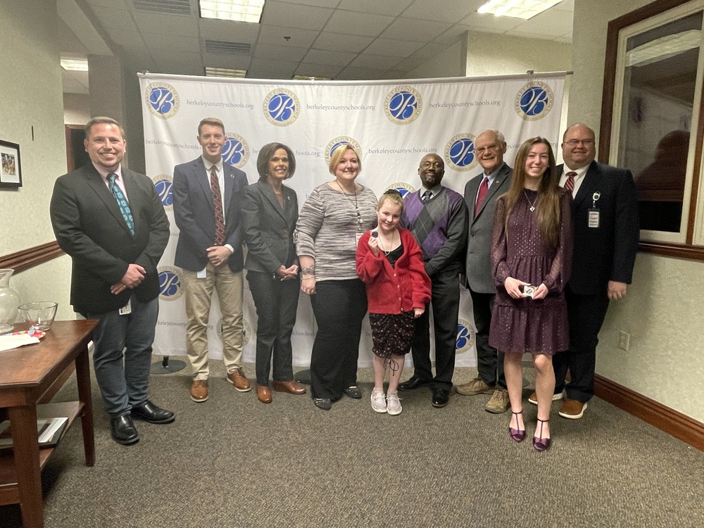 Tyler Hawn, members of the board, dr.Saxe, and two students